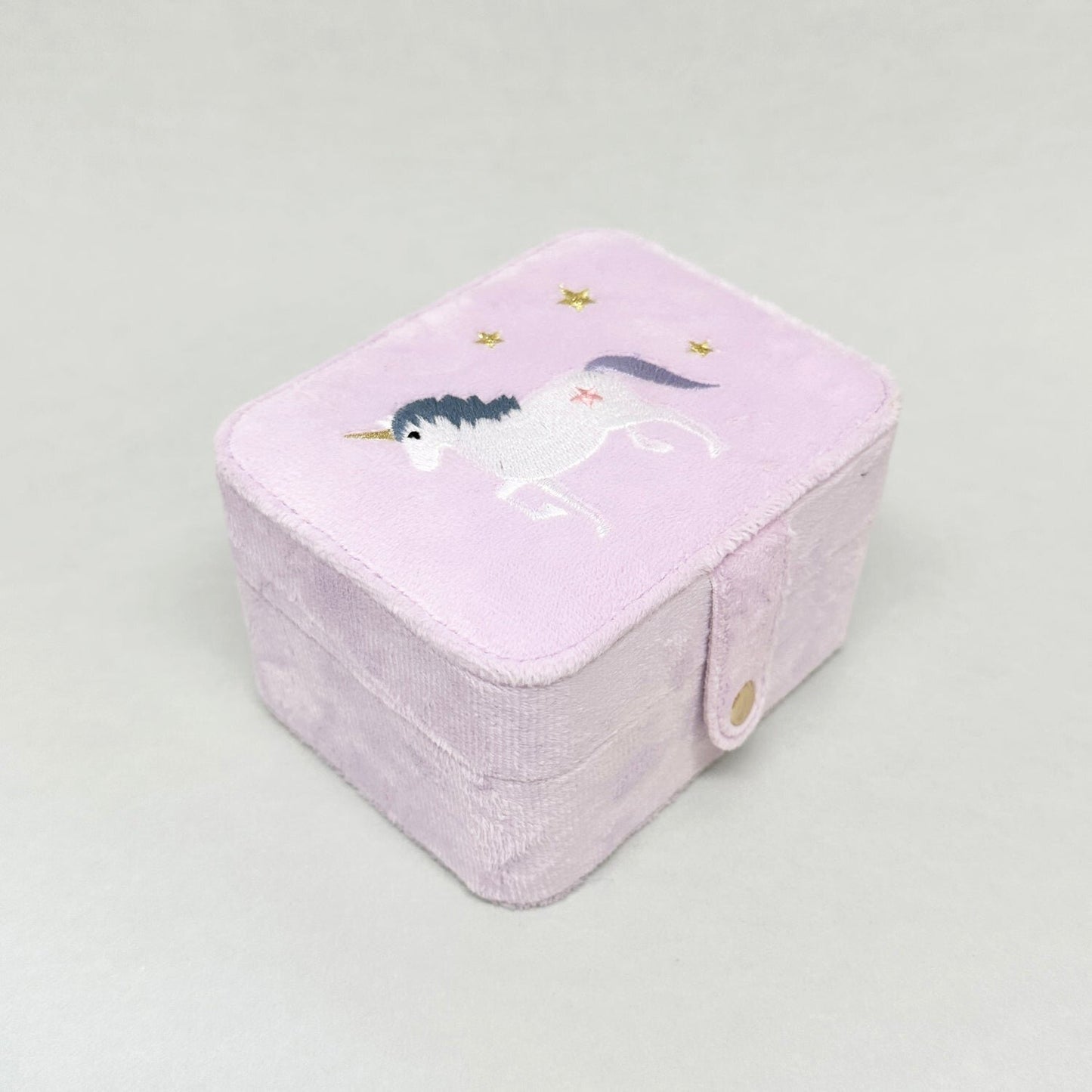 Unicorn theme pink velvet jewellery box with spaces for rings and childrens jewellery. white unicorn with golden stars