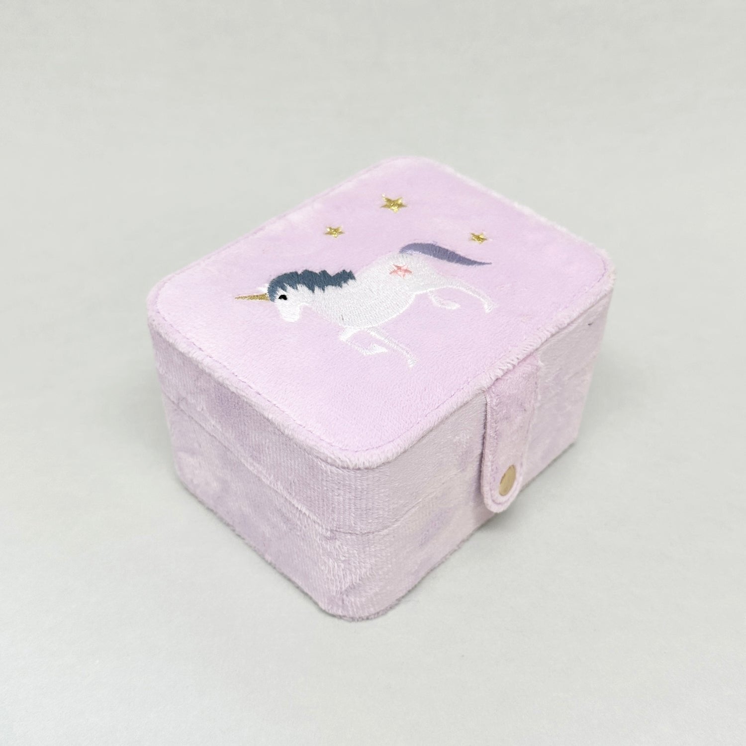 Unicorn theme pink velvet jewellery box with spaces for rings and childrens jewellery. white unicorn with golden stars