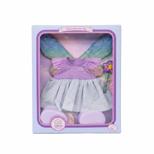 Fairy dress-up set in packaging with a purple dress, white skirt, and rainbow shoes. Fairy Dress-Up Accessory Set for Dinkum Dolls by Olli Ella – Interactive Toy Clothing Pack