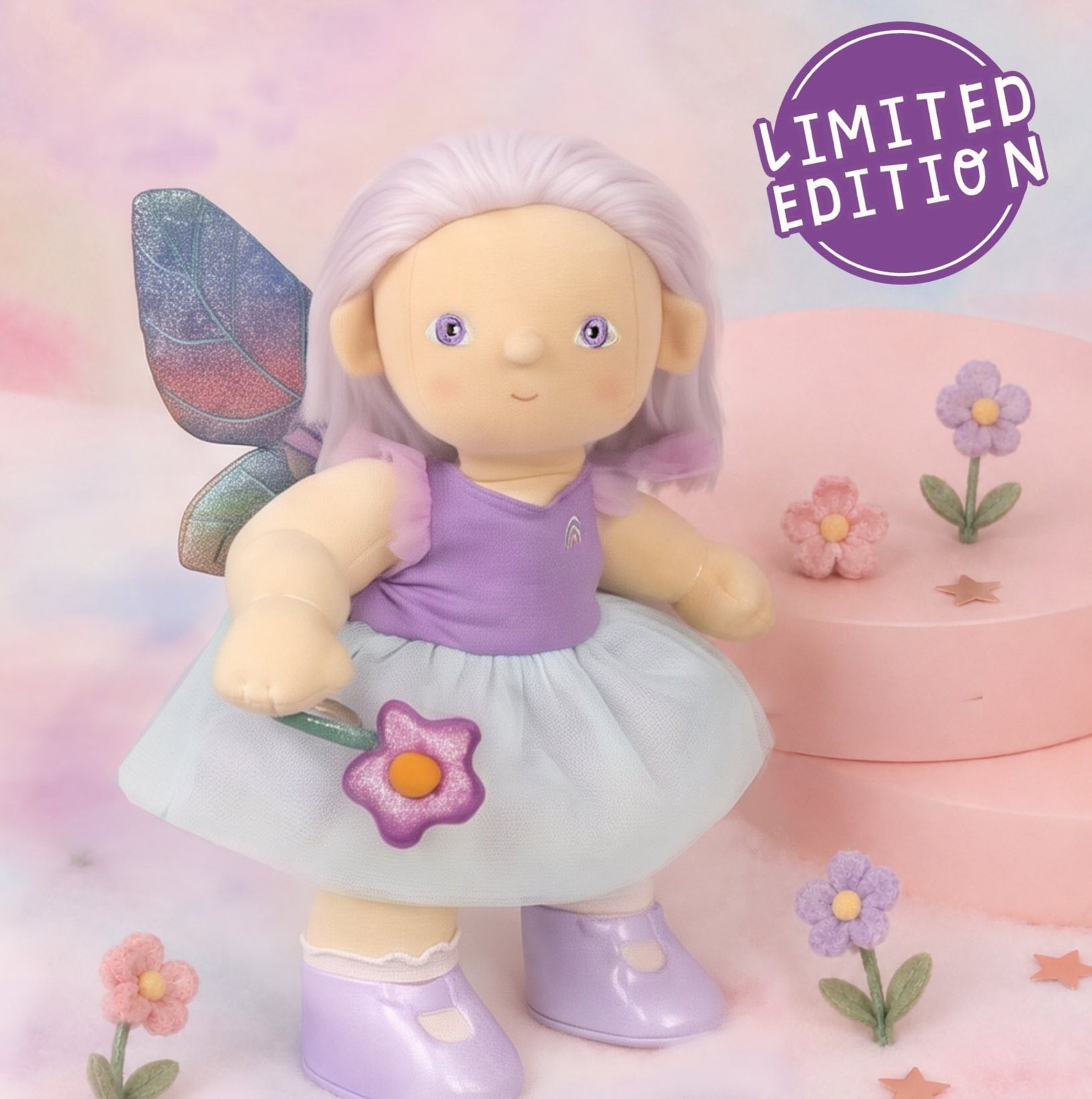 Fairy doll with purple outfit and wings on a pastel background with 'Limited Edition' text.