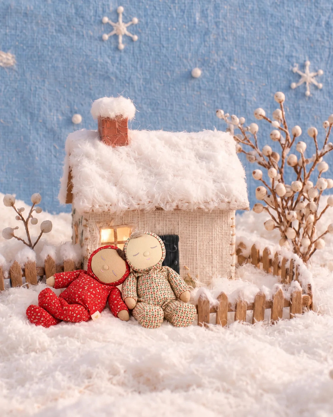 Olli Ella Dozy Dinkum Pie Hollyrose paired with Olli Ella Dozy Dinkum Twinkle Berryheart in a wintery snowy setting