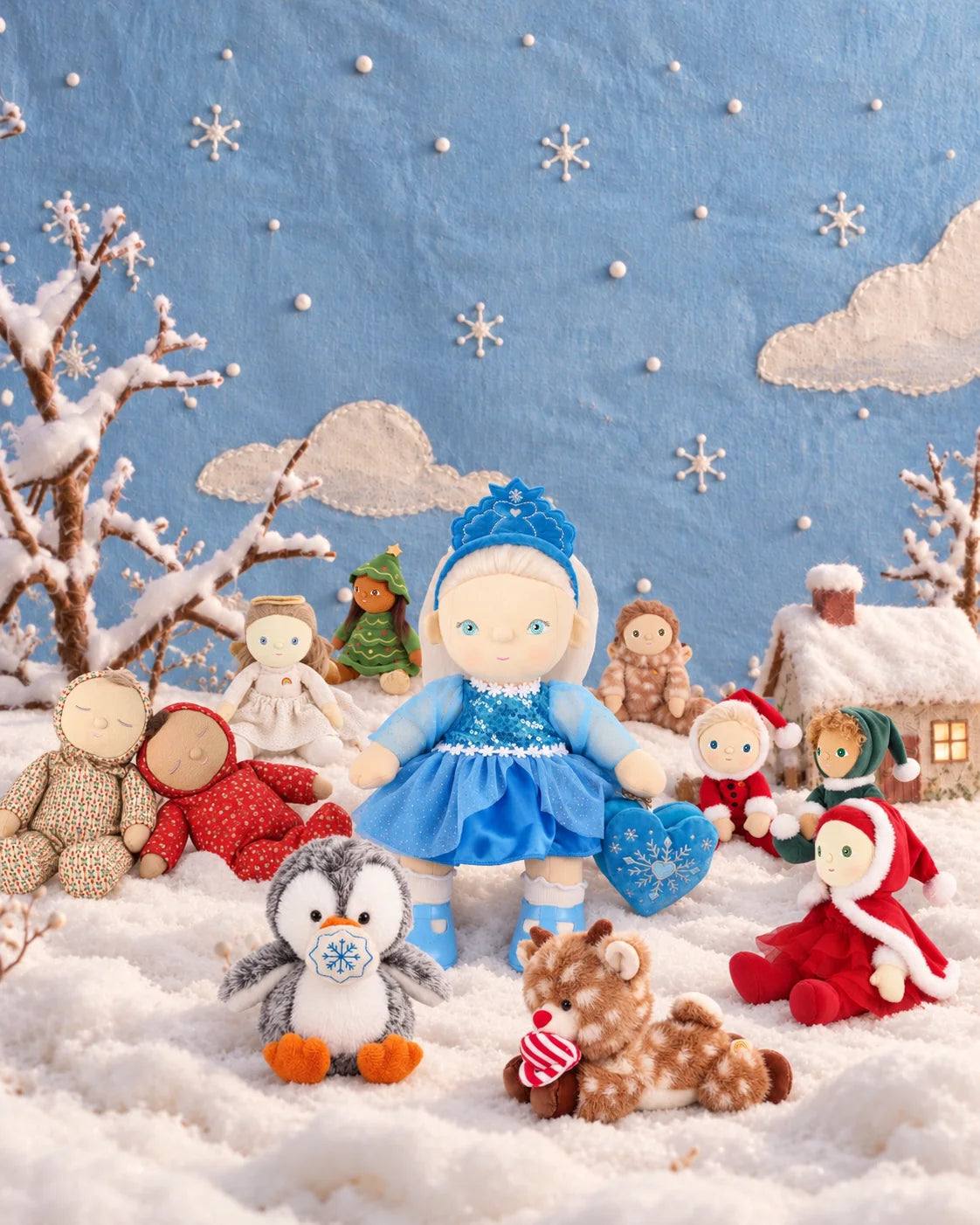 Olli Ella Holiday Hollow collection featuring Dream Dinkum Doll Elsie Ice with festive Dinky Dinkums and Dozy Dinkums in snow