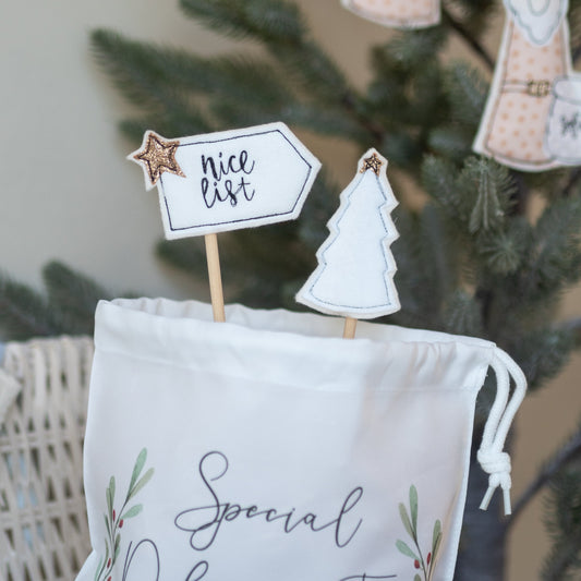Small Christmas 'Nice List' mini flag, hand embroidered white flag with hand stitched nice list wording for stocking fillers or Christmas decor by Girl Friday Embroidery at Mouse in a Box
