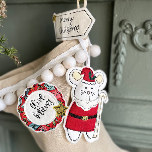 Hand embroidered 'I'm a believer' Christmas badge for Children, a red rosette badge with a personalised name for a Children's Christmas gift by Girl Friday Embroidery at Mouse in a Box